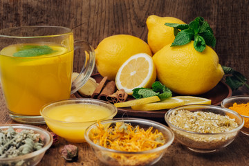 Fototapeta na wymiar Lemon and herbal tea for better health and immunity system