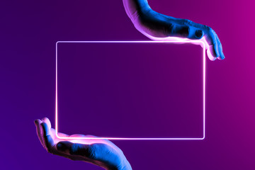 Human Hands Holding Neon Frame. Hands Illuminated by Pink, Violet and Blue Neon Lights. 3d rendering - obrazy, fototapety, plakaty