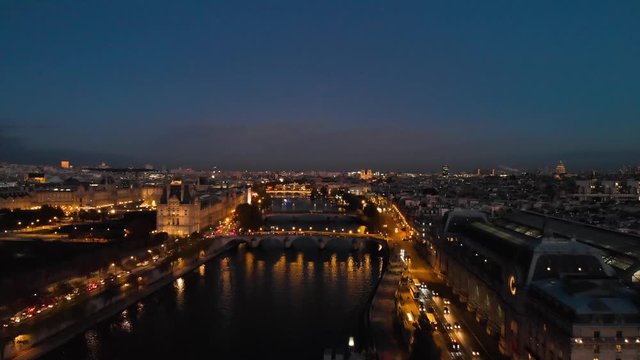 Aerial view of Paris Gare d'Orsay Musee d'Orsay train station Paris Seine River and Paris Tuileries Garden park at night