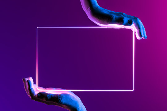 Human Hands Holding Neon Frame. Hands Illuminated by Pink, Violet and Blue Neon Lights. 3d rendering