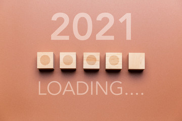 Wooden cubes with progress bar, waiting for the new year 2021 concept