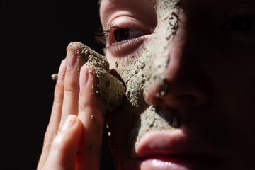 Woman using organic cosmetic mask (scrub) with natural extracts © BUDDHA