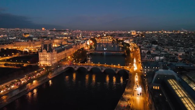 Aerial Paris night view of Louvre Museum and Tuileries garden Paris city attractions, France 