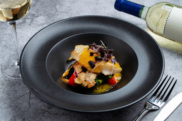 Fried halibut with mini vegetables and mango sauce as a creative chef's special meal