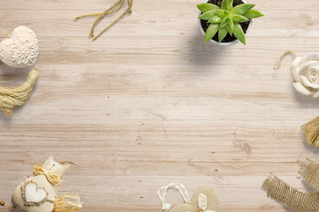 Composition with decoration objects on wooden desk and free space in the centre as template for hero header images