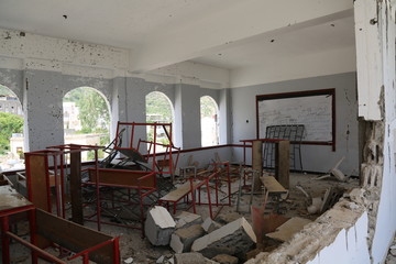  A school destroyed by Arab coalition missiles after Al-Houthi militia turned it into a military barracks in Taiz City .