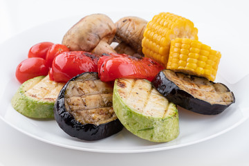 Plate with Grilled vegetables isolated on white background