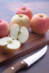 Close up of slice of apple on chopping board 