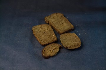 Pieces of bread on a blue background