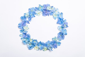 Flowers composition. Frame made of blue flowers hydrangea on white background. Creative floral texture. Flowers pattern, flat lay. Spring holidays, Easter, Mothers day concept. Top view, copy space