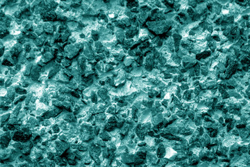 Old stone surface in cyan tone.