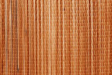 Straw mat texture in orange tone.
