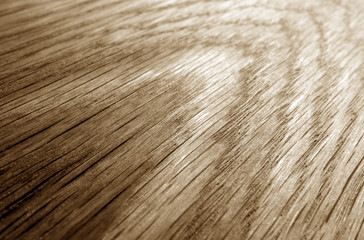 Wooden board texture with blur effect in brown tone.