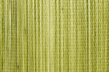 Straw mat texture in yellow tone.