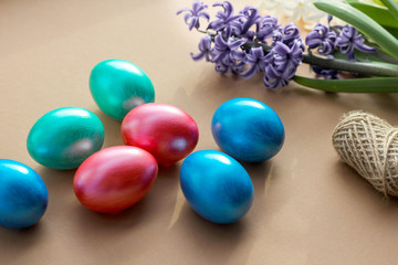 Obraz na płótnie Canvas Easter decor. multi-colored eggs on a brown background