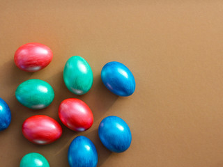 multi-colored eggs on a brown background. concept of Easter decorations