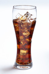 cola with ice cubes on white