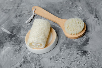 Eco-friendly home spa still life with dry body brush and a sponge. Traditional body care concept...