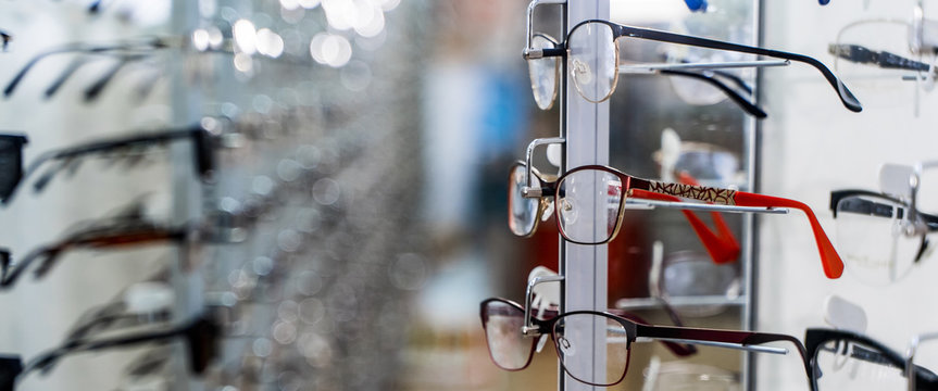 Eye Glasses In A Store. Eyeglasses Shop. Stand With Glasses In The Store Of Optics.