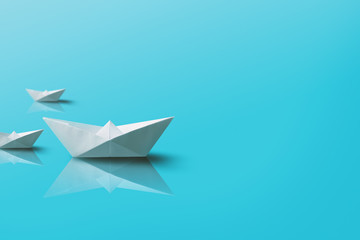 Paper Boats on Blue Background. Origami Boat Background.
