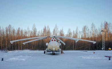 Fototapeta na wymiar russian helicopter mi 8 under covers in winter