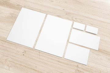Blank paper stationery set on wooden desk background as template for logo, embossing and other esign presentation, pomotion etc.