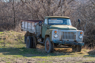  old abandoned soviet car in the forest