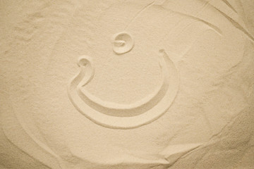Fototapeta na wymiar arabic letters painted in the sand