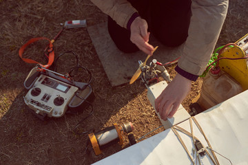 A man prepares a radio-controlled aircraft for flight.
