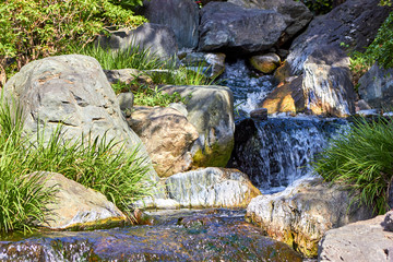 Small waterfall in Japanese style garden