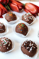 Homemade chocolates with almond chips. Vegan dessert.