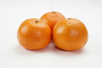 Ripe oranges isolated on a light background