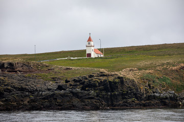 Fototapeta na wymiar Church seen from the ocean, Grimsey, Iceland