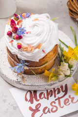 Easter Cake - Russian and Ukrainian Traditional Kulich or Brioche on a light stone background. Paska or Panettone Bread with card 