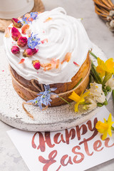 Easter Cake - Russian and Ukrainian Traditional Kulich or Brioche on a light stone background. Paska or Panettone Bread with card 