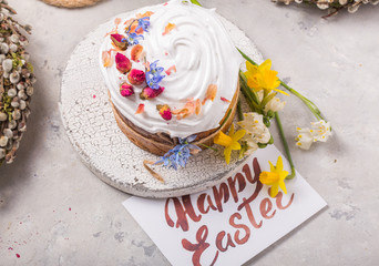 Easter Cake - Russian and Ukrainian Traditional Kulich or Brioche on a light stone background. Paska or Panettone Bread with card 