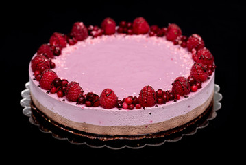 Raw vegan cake with chocolate and raspberries, a healthy and tasty dessert, sugar-free, gluten-free