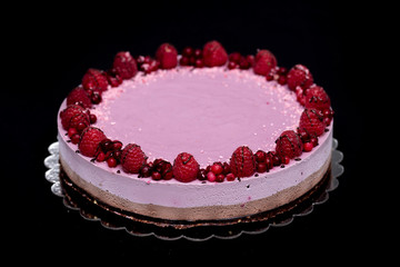 Raw vegan cake with chocolate and raspberries, a healthy and tasty dessert, sugar-free, gluten-free