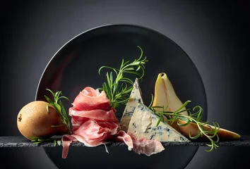 Foto op Canvas Prosciutto or spanish jamon with blue cheese, pears and rosemary. © Igor Normann