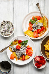 Pncakes with mushrooms sauce on white table