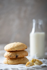 Morning Chocolate chip cookies with milk in bottle on table. Homemade breakfast.
