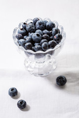 Ripe blueberry in glass bowl