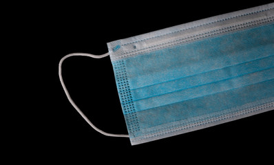 Medical mask isolated on black background