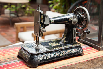 Fashion and manufacturing industry; old sewing machine.