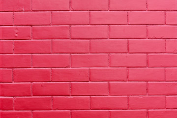 Minimalist monochome background of fresh vivid pink red painted bricks in horizontal display
