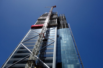 A tall skyscraper beeing built in Newzealands largest city Auckland. Looking at the modern facade...