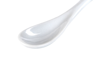 White ceramic spoon isolated on a white background
