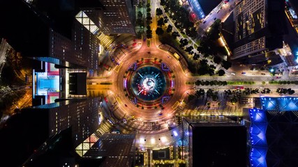 4K Hyperlapse time-lapse of car traffic transport at roundabout fountain of wealth in Singapore, drone aerial top view, fly upward. Transportation technology, city life, Asia travel landmark concept - Powered by Adobe