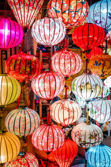 Traditional colorful lanterns spread light on the old street of Hoi An Ancient Town - UNESCO World Heritage Site. Vietnam in 2019.