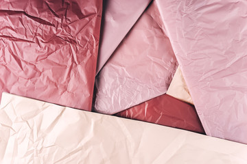 Crumpled pink gold and purple wrapping paper